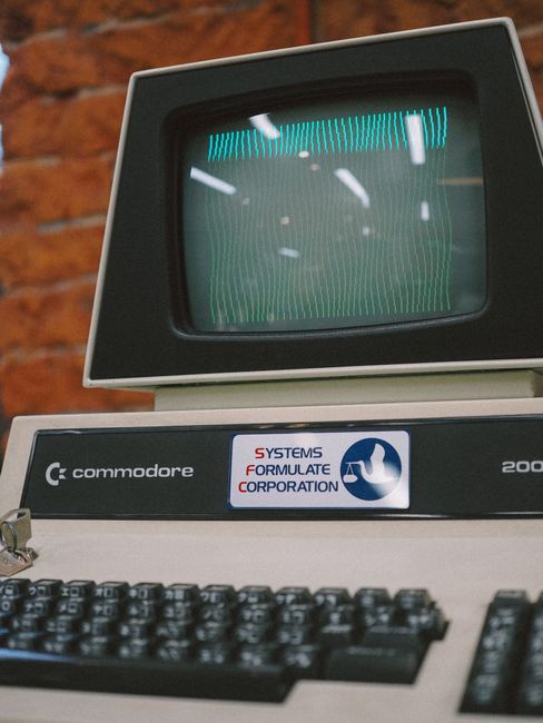 Close-up of a vintage Commodore computer with a CRT monitor and keyboard, showing retro technology.